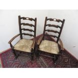 Pair of child's ladder back rush seat rocking chairs (2)