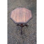 Late Victorian carved oak octagonal top occasional table with carved and turned column and three