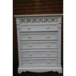 White painted chest of five long drawers with fretwork panel to the top W80cm D34cm H100cm