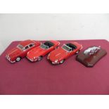Two 1:18 scale models of E type Jaguars, another Jaguar mk2 1959 and a Jaguar mascot on plinth (4)