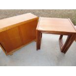 Nest of three vintage teak rectangular tables on open work supports W54cm L43cm H49cm and an oak two