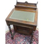 Victorian mahogany davenport with raised lift up top section with carved detail, revealing fitted