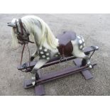 Dappled grey rocking horse, with real hair mane and tail, leather saddle, iron swing base on