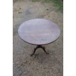 19th C oak circular tilt top tripod table on turned column and three outsplayed supports