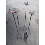 Two pairs of wrought metal floor standing altar style candle stands and a fire companion set (5)