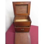 Late Victorian mahogany table cabinet with hinged top and fall front above two drawers with recessed