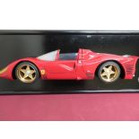 Wall mounted half model of a Ferrari sports car on black backboard (62cm)