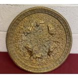 Cast brass indian wall plaque decorated with lions in a naturalistic setting D45cm