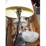 Pair of German brushed stainless steel table lamps with marble effect glass shades and a table