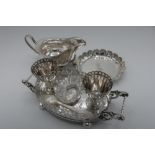 Edwardian EPNS two cup oval egg cruet with pierced borders, scroll handles and ball feet (L.19cm),