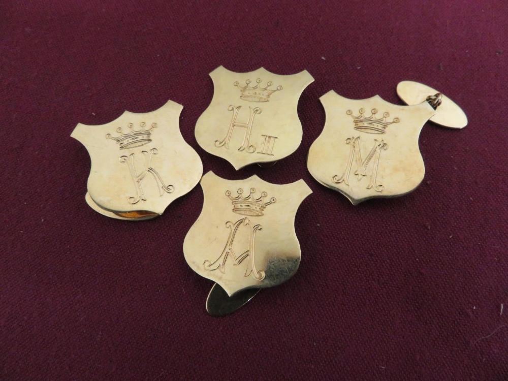 Set of four gold coloured metal shield shaped cufflinks engraved K H A M beneath crown 24.6g (4)