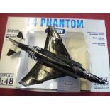 Two boxed F4 Phantom collection armour 1:48 scale diecast aircraft and another similar Franklin mint