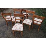 Set of six country style dining chairs with upholstered seats and turned supports