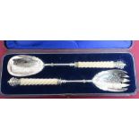 Pair of Victorian EPNS salad servers, with barley twist ivory turned handles and crown finials, in