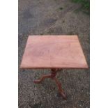 Victorian mahogany rectangular tilt top tripod table on turned column and three outsplayed supports