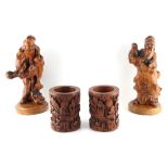 Property of a gentleman - a pair of Chinese carved rootwood figures, the taller 12ins. (30.5cms.)