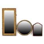 Property of a gentleman - a circular framed wall mirror with bevelled glass, 20ins. (51cms.)