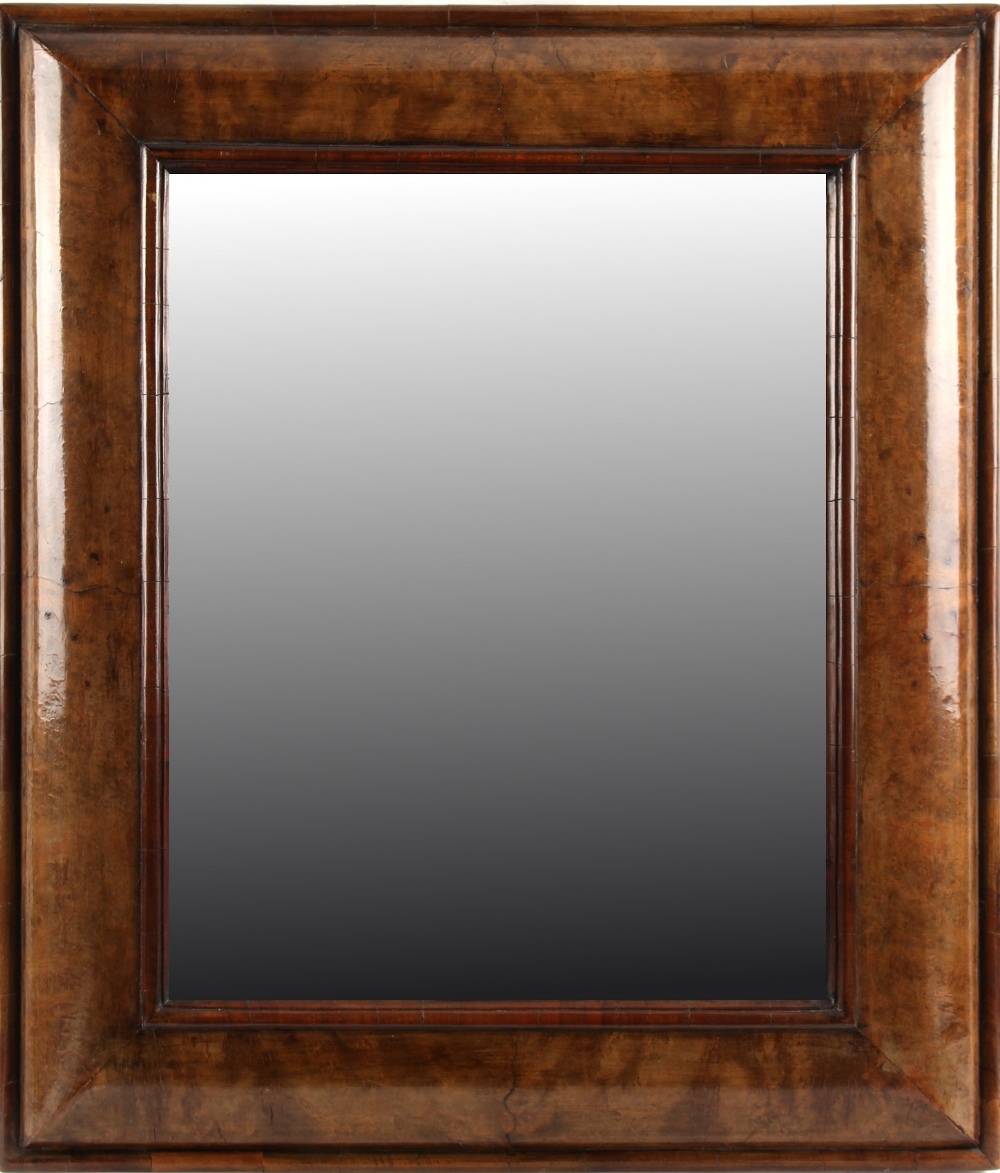 Property of a gentleman - an early 18th century walnut rectangular cushion framed wall mirror, 27 by