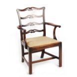 Property of a gentleman - a George III country Chippendale mahogany pierced ladder-back elbow chair,