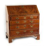 Property of a gentleman - an early 18th century Queen Anne period walnut & featherbanded bureau,