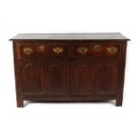Property of a lady - an oak side cabinet with two drawers above two fielded twin panelled doors,