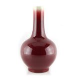 A Chinese langyao type sang de boeuf glazed bottle vase, drilled, 11.2ins. (28.4cms.) high.
