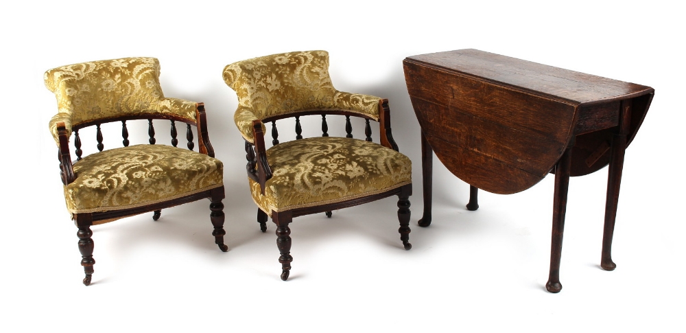 Property of a gentleman - a pair of Edwardian salon tub chairs with floral upholstery; together with