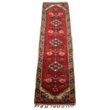 Property of a gentleman - a Turkish Doshe woollen hand-made runner with red ground, 114 by 30ins. (