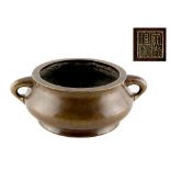 A Chinese bronze two-handled censer, of bombe form, 18th century, 4-character seal mark to base, 7.