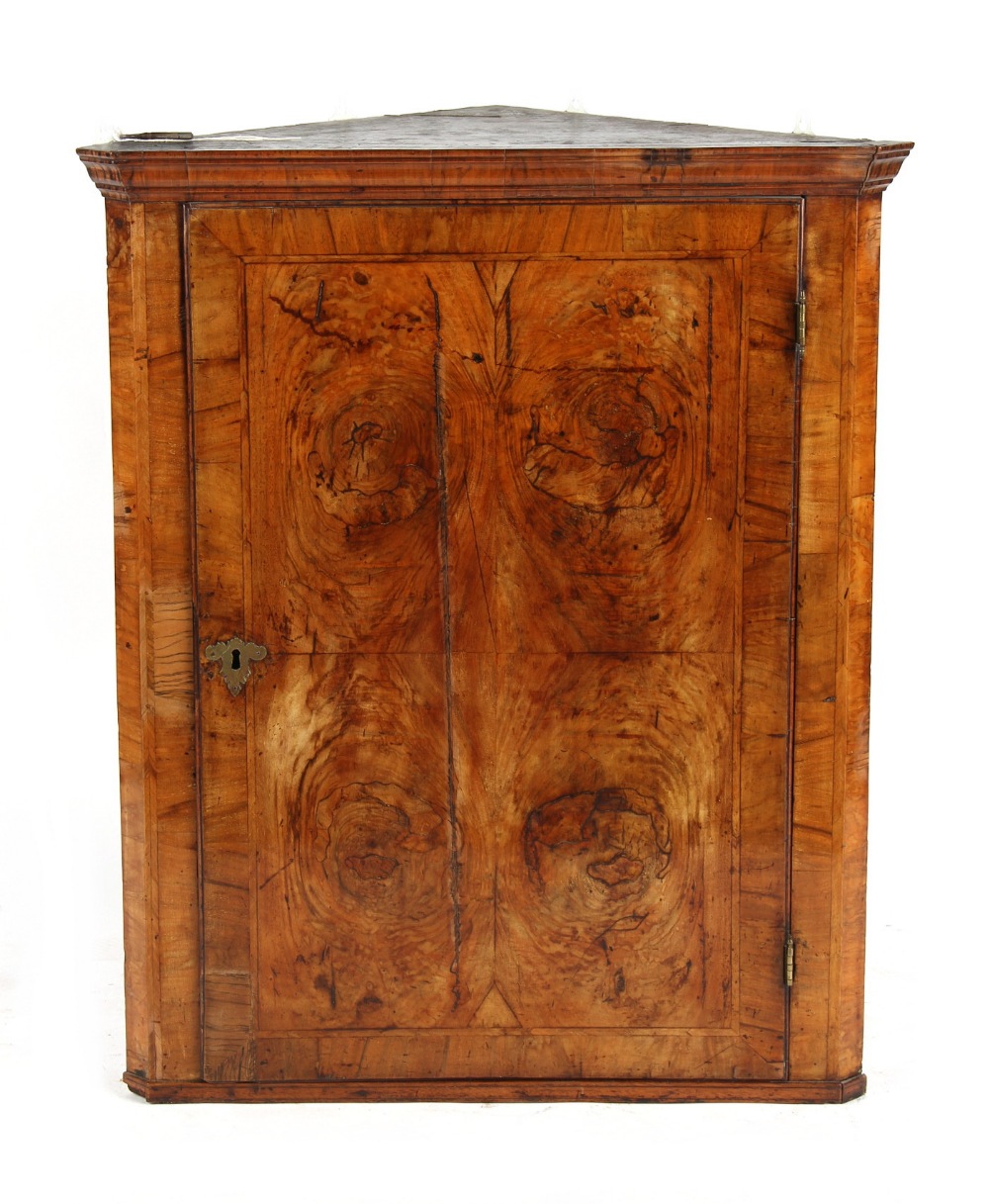 Property of a gentleman - an early 18th century walnut & featherbanded corner wall cabinet, the