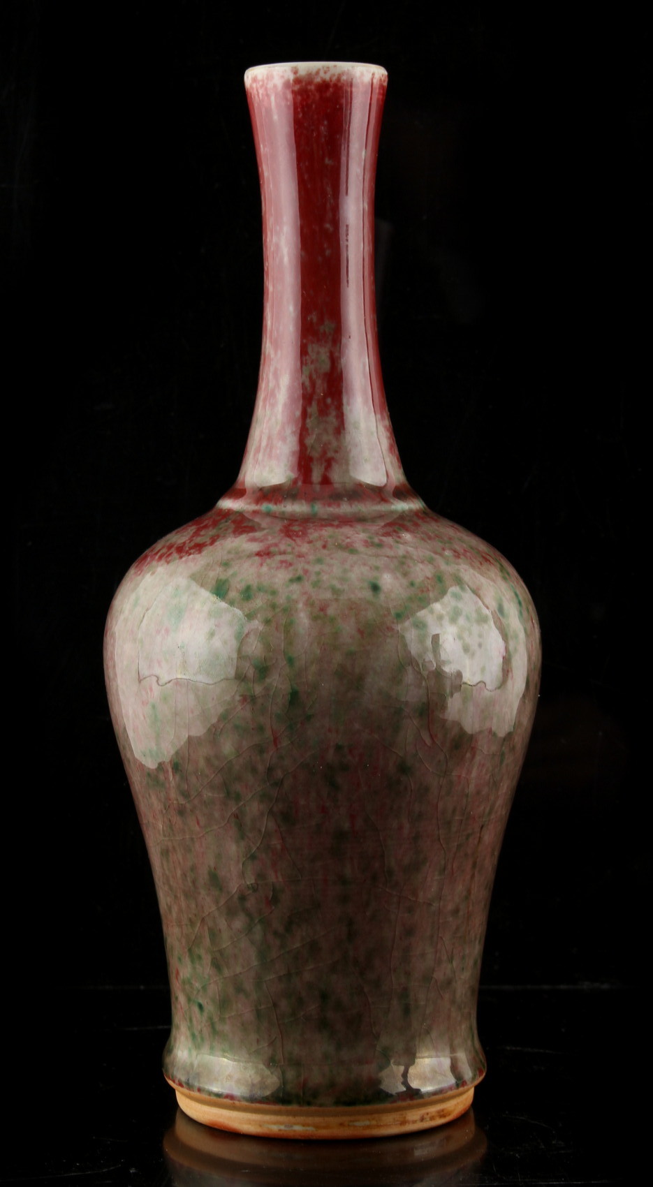 A Chinese peach bloom baluster vase, 20th century, 9ins. (23cms.) high.