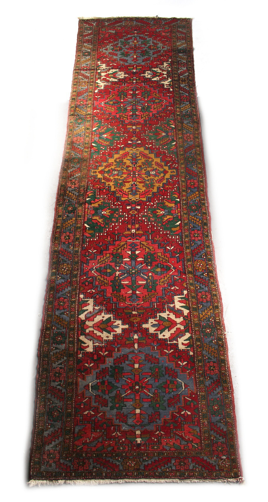 Property of a gentleman - a Turkish woollen hand-made runner with red ground, 174 by 46ins. (442