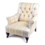 Property of a gentleman - a Victorian walnut & upholstered armchair, with turned front legs &