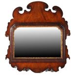 Property of a gentleman - an early 18th century walnut & parcel gilt fretwork framed wall mirror,