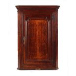 Property of a deceased estate - a late 18th century George III oak & mahogany corner wall cabinet,