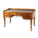 Property of a gentleman - a Victorian oak writing table with inset top, 54ins. (137cms.) wide.