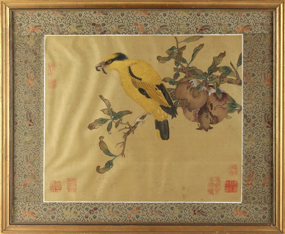 An early 20th century Chinese painting on silk depicting a bird on a fruiting pomegranate branch