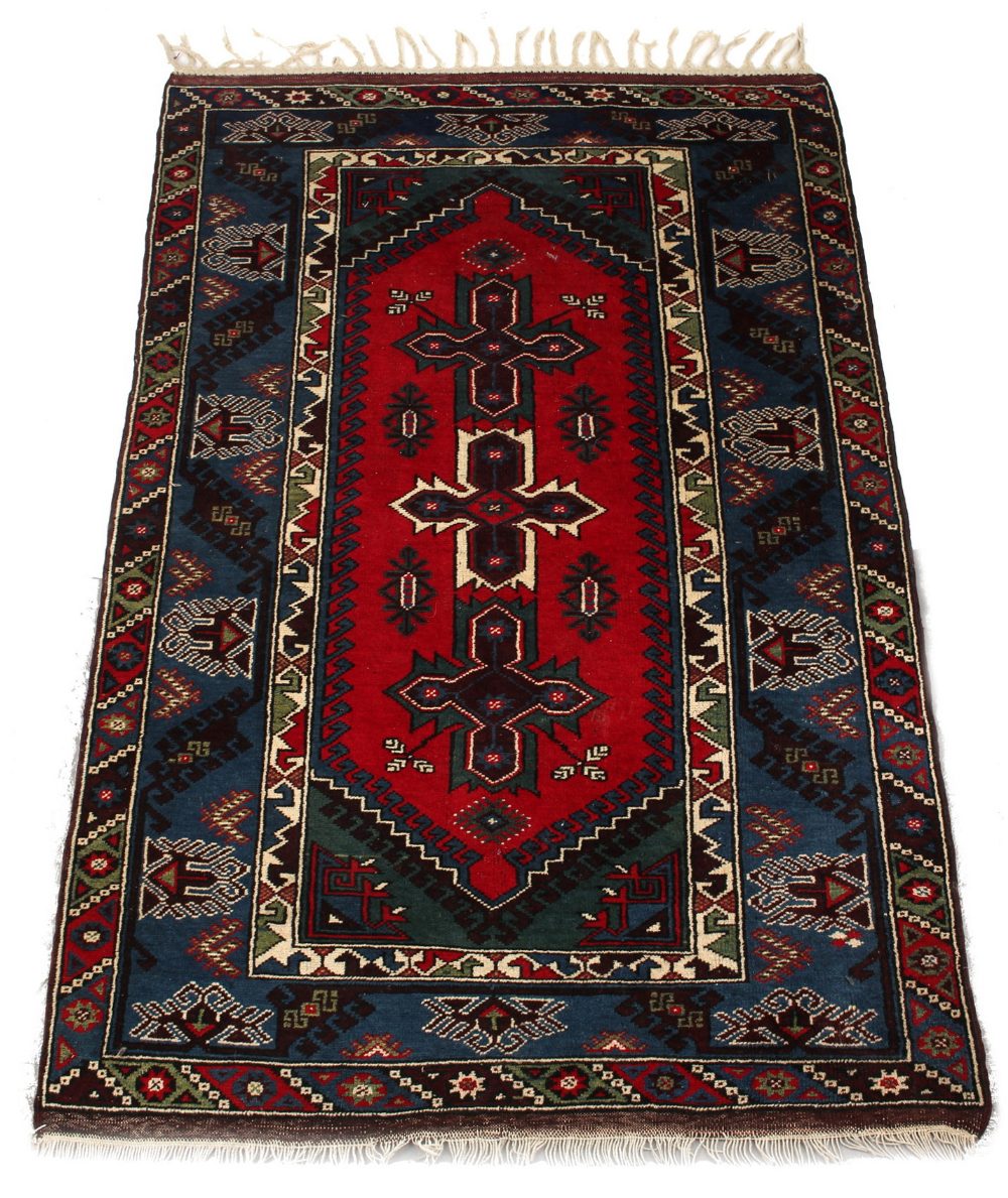 Property of a gentleman - an Anatolian woollen hand-made carpet with red & blue ground, 79 by 51ins.