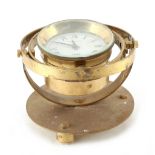 Property of a deceased estate - a GRM Yachtmaster brass gimballed ship's clock, 6.25ins. (15.