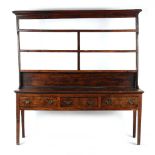 Property of a deceased estate - a George III oak two part Welsh dresser, with three tier plate