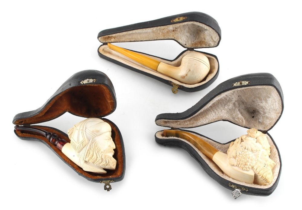 Property of a lady - three meerschaum type pipes, each in a fitted case (3).
