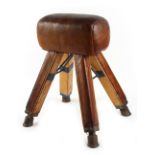 Property of a gentleman - a leather covered gymnastics pommel horse, approximately 32ins. (81cms.)