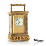Property of a lady - a late 19th / early 20th century French brass cased miniature carriage clock