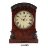 Property of a lady - an early 19th century William IV carved mahogany cased bracket clock, with twin