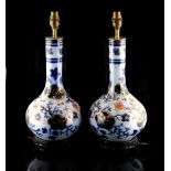 A pair of Victorian Japan pattern bottle vases, adapted as table lamps, each 17.3ins. (44cms.)