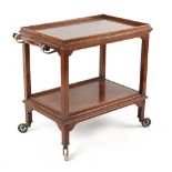 Property of a lady - an early 20th century mahogany two-tier supper trolley with brass handle &