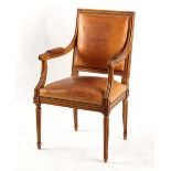 Property of a deceased estate - a Louis XVI style tan leather upholstered open armchair.