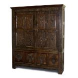 Property of a gentleman - a large carved oak two-door cupboard, elements 18th century, 80.75ins. (