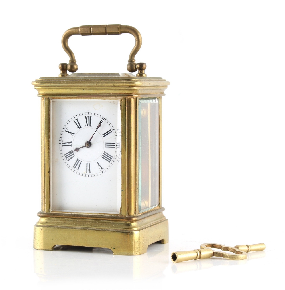 Property of a lady - a late 19th / early 20th century French brass cased miniature carriage clock