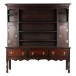 Property of a gentleman - an 18th century George III oak dresser, the plate rack with two shaped